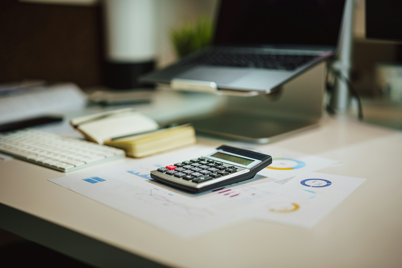 Calculator and laptop used to work out multi-state remote work taxes